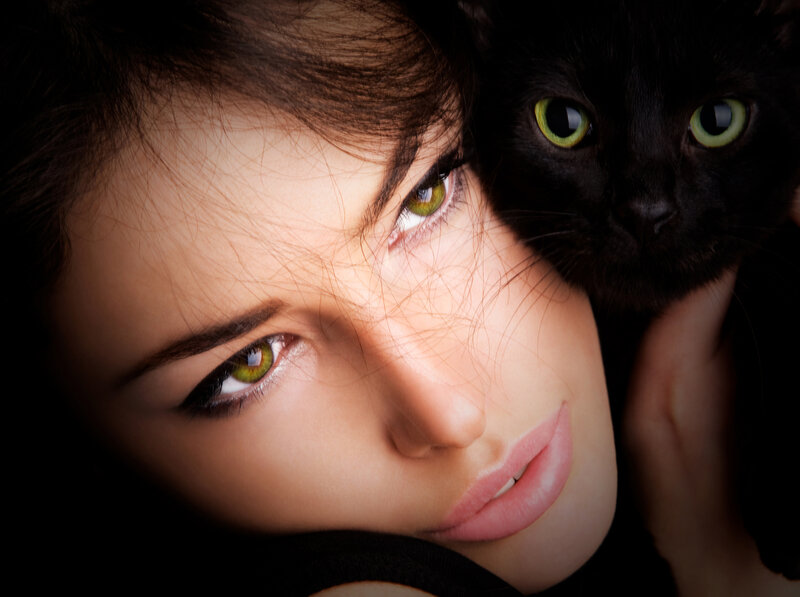 Woman with Black Cat — Dramatic, Photograph