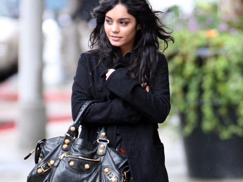 woman with black coat and bag