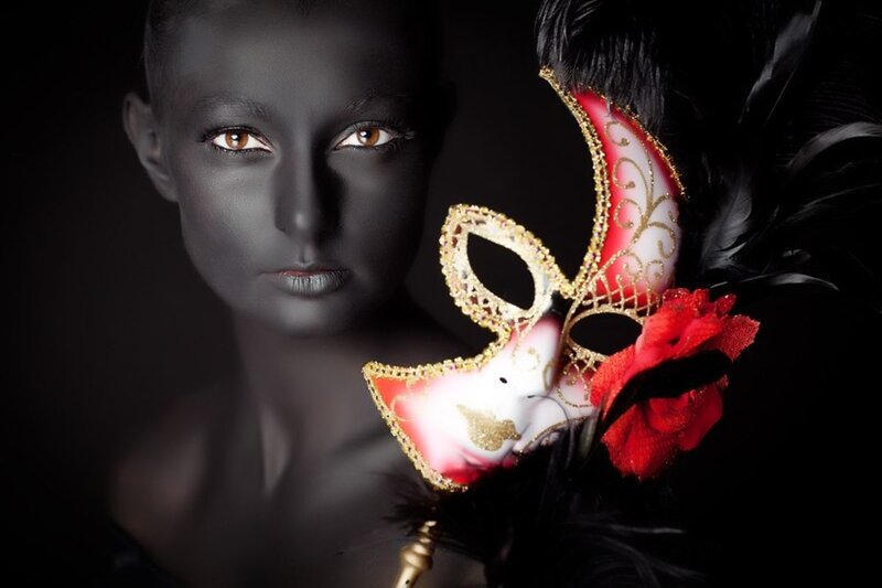 Woman with Black Face Paint — Dramatic