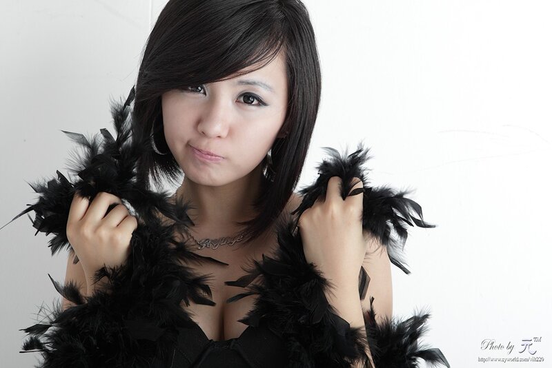 woman with black feather boa