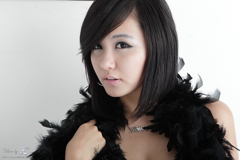woman with black feather boa