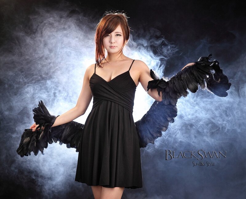 woman with black feather wings