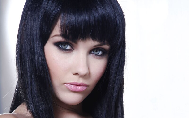 woman with black hair and blue eyes