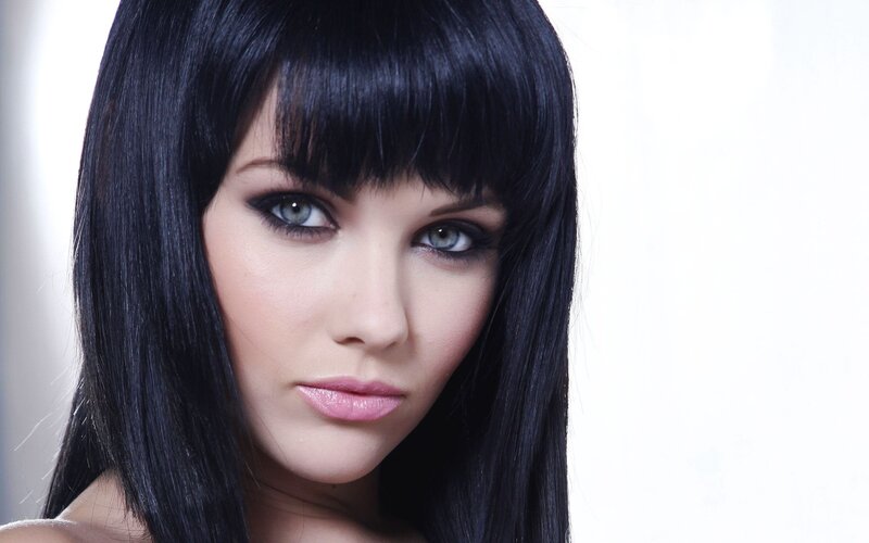 woman with black hair and blue eyes