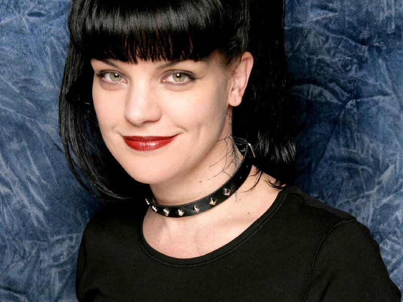woman with black hair and choker