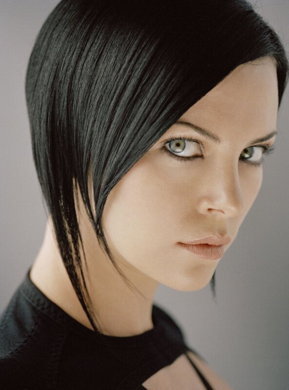 woman with black hair and green eyes