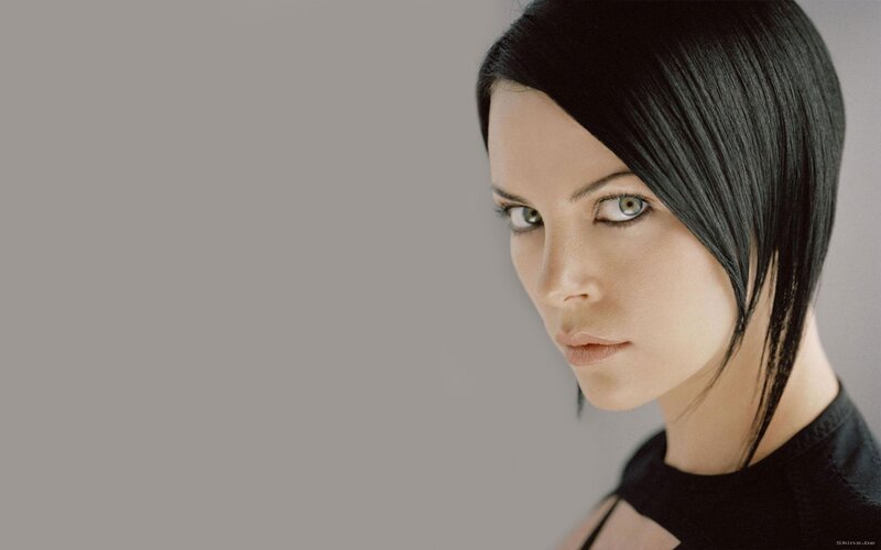 woman with black hair and green eyes