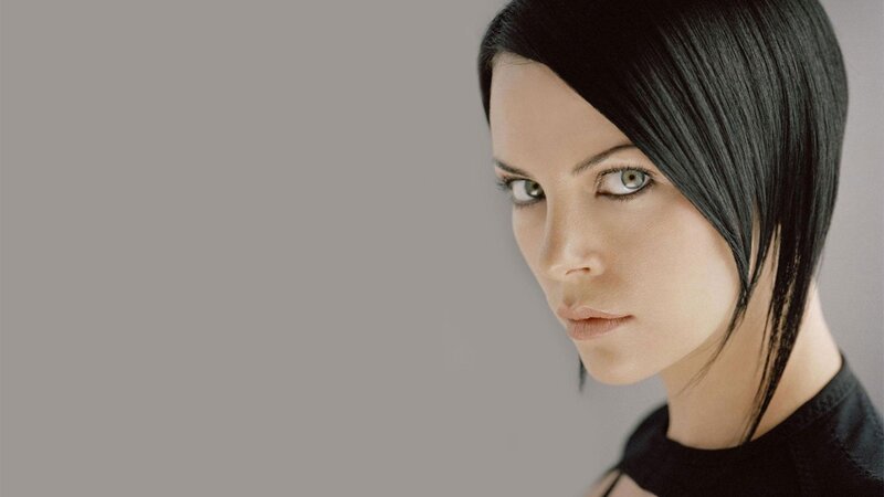 woman with black hair and green eyes