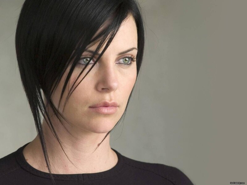 woman with black hair and green eyes