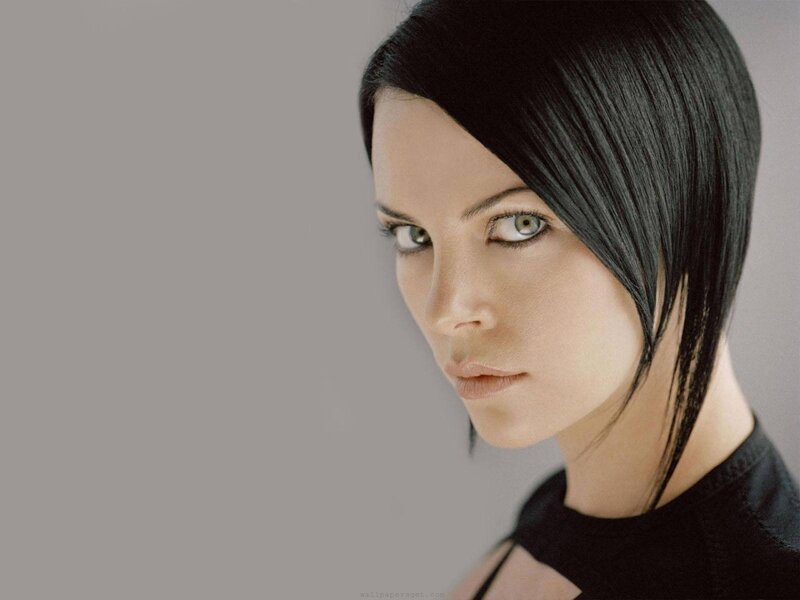 woman with black hair and green eyes