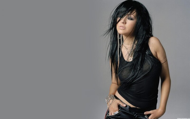woman with black hair and jewelry