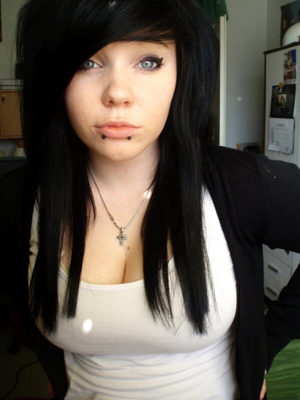 woman with black hair and lip piercing