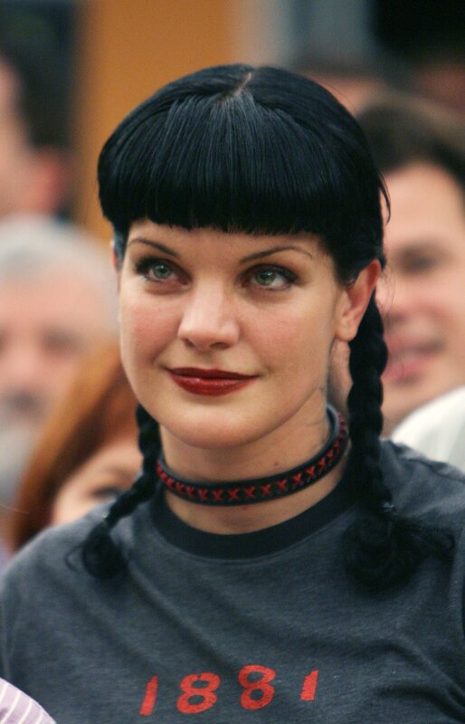 woman with black hair and red lipstick
