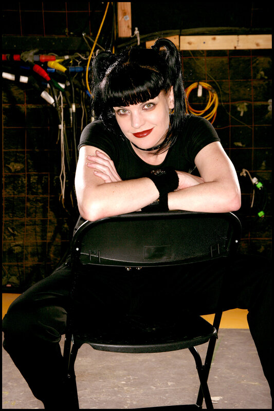 woman with black hair and red lipstick