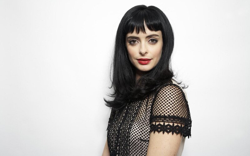 woman with black hair and red lipstick