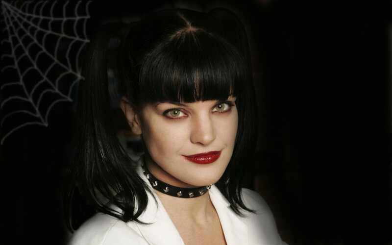 woman with black hair and red lipstick