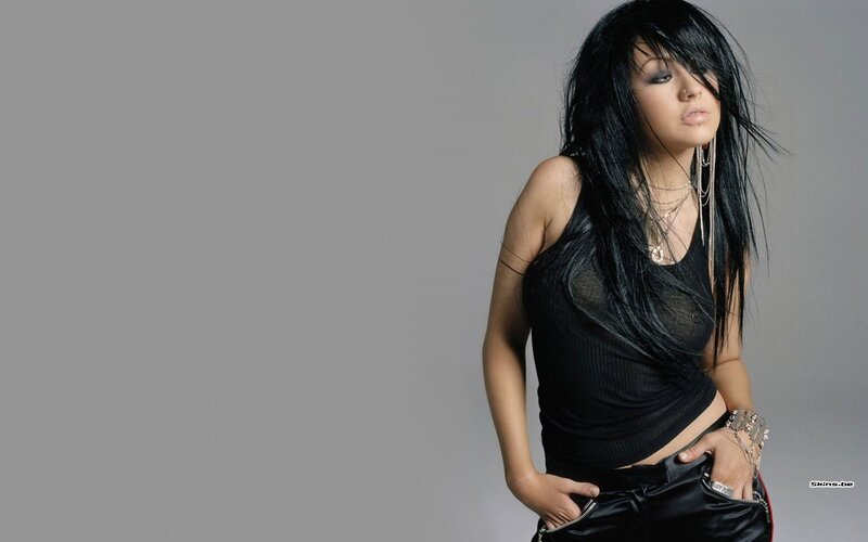 woman with black hair and tank top