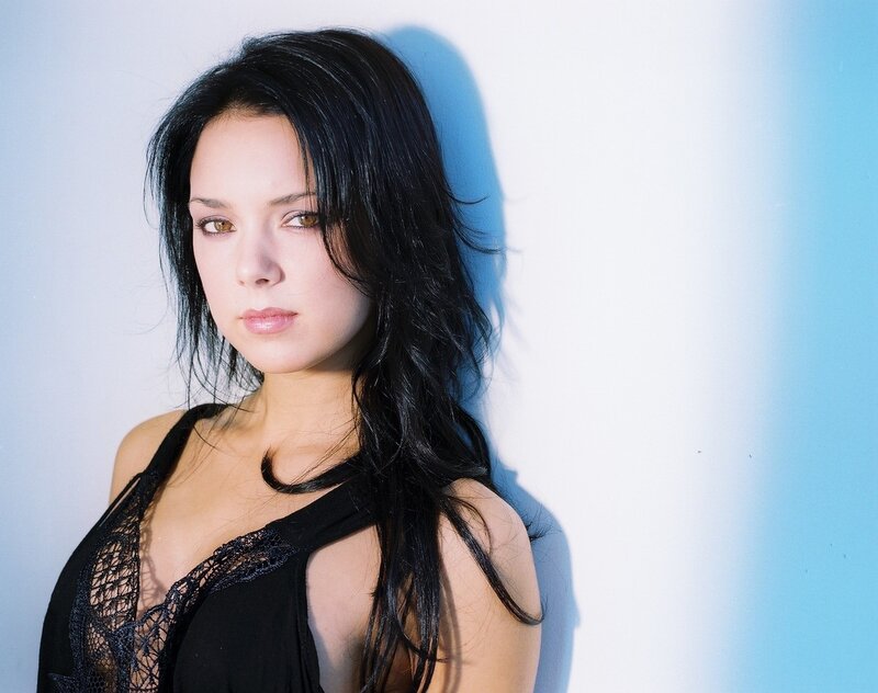 Woman with Black Hair — Dramatic, Photograph, Black Top, White Wall