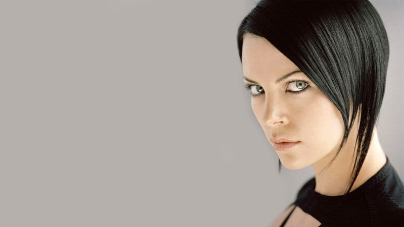 Woman with Black Hair — Gray, Serious, Photograph