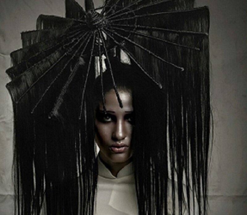 Woman with Black Hair Headpiece — Dramatic