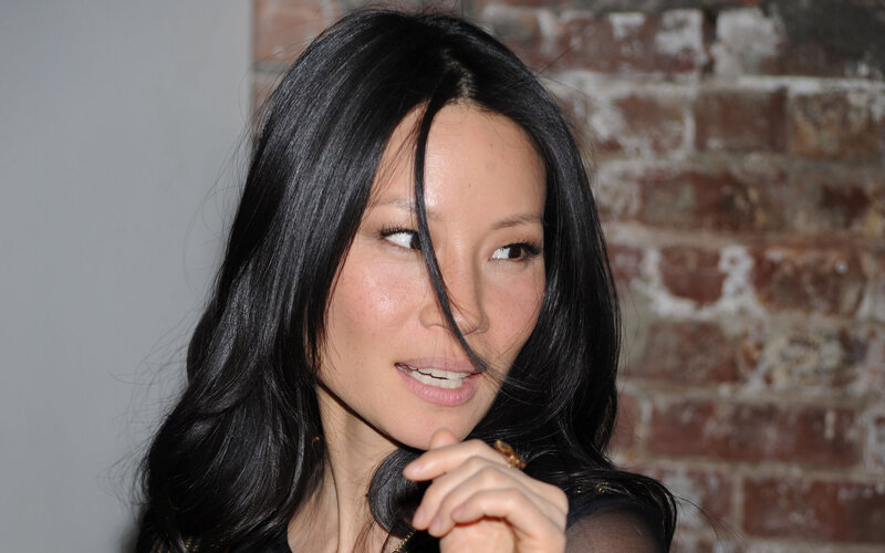 Woman with Black Hair — Neutral, Photograph, Brick Wall