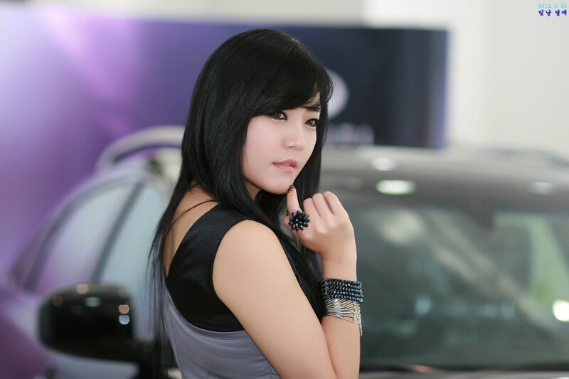 Woman with Black Hair — Neutral, Photograph, Car, Ring