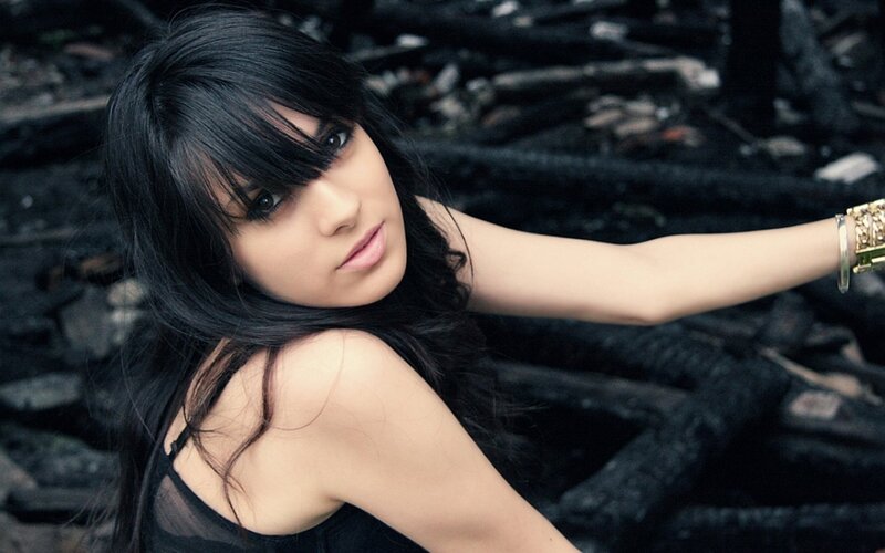 woman with black hair posing