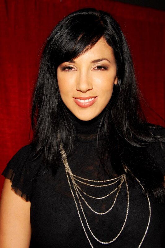 woman with black hair smiling
