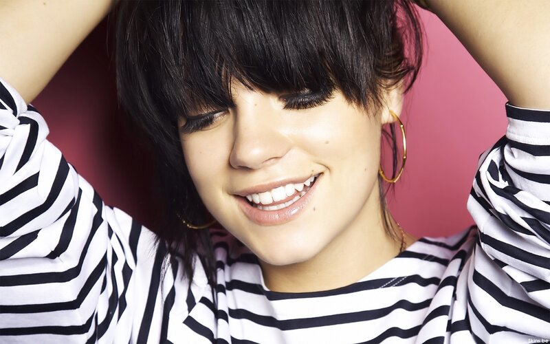 woman with black hair smiling