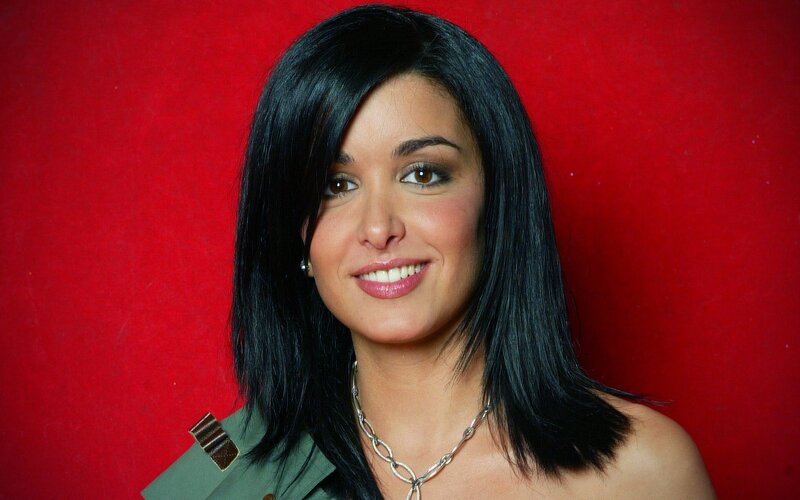 woman with black hair smiling