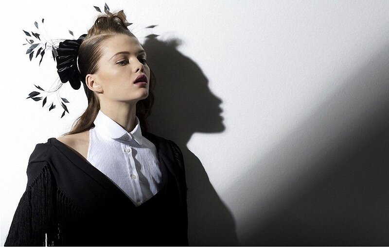 woman with black headpiece