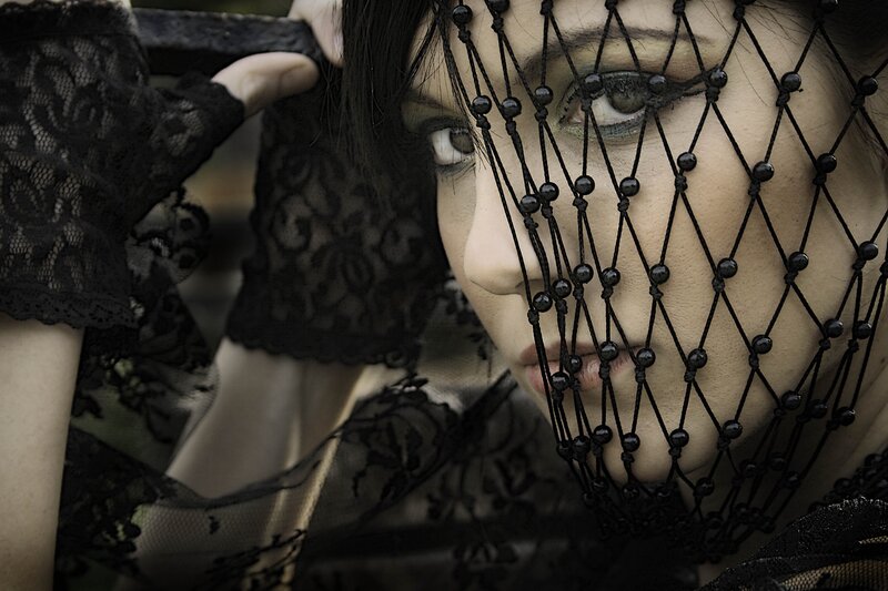 woman with black lace veil