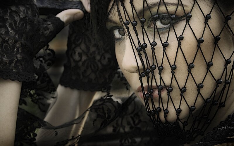 woman with black lace veil