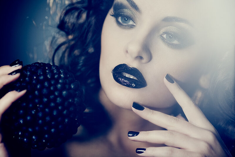 woman with black lipstick and berries