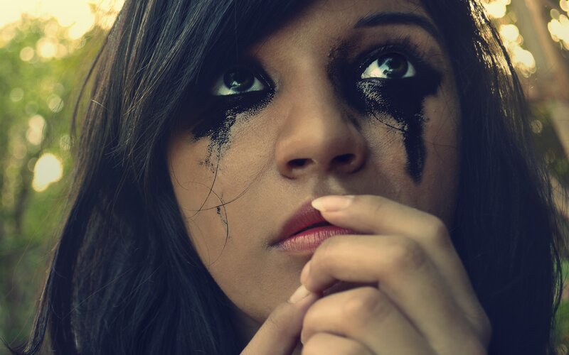 woman with black makeup tears