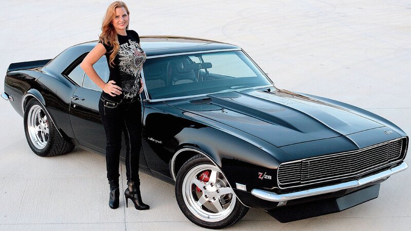 woman with black muscle car