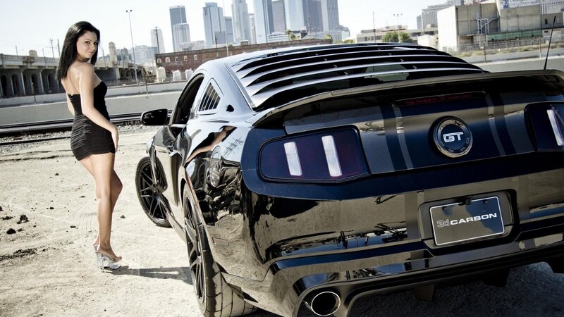 woman with black mustang car