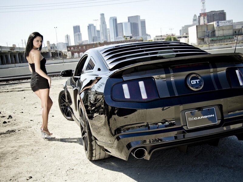 woman with black mustang car