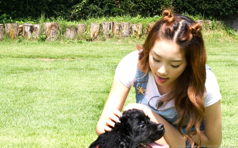 woman with black puppy outdoors