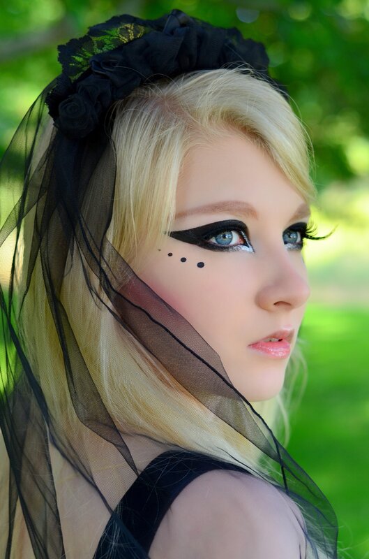 woman with black veil and makeup