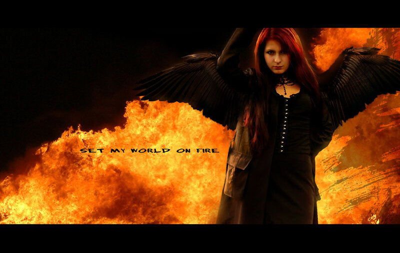 woman with black wings and fire