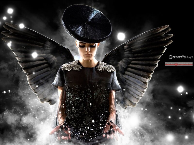 woman with black wings and hat
