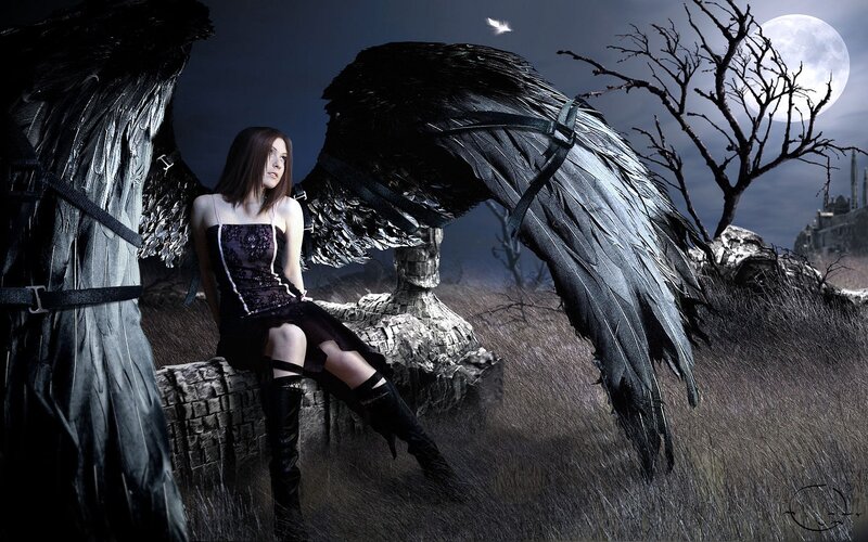 woman with black wings at night