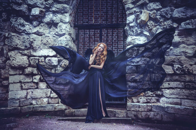 Woman with Black Wings — Dramatic, Photograph, Stone Wall