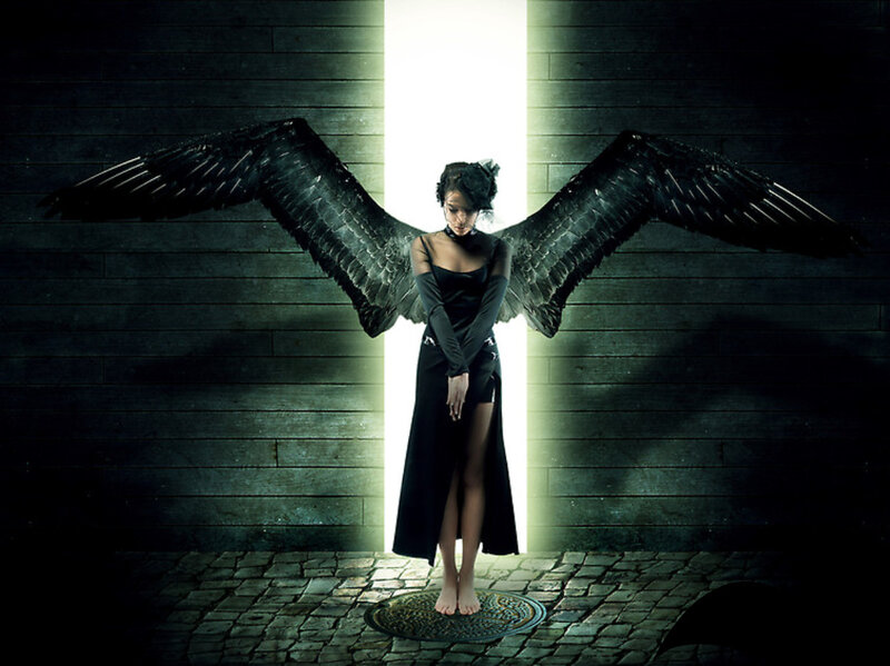 woman with black wings in light