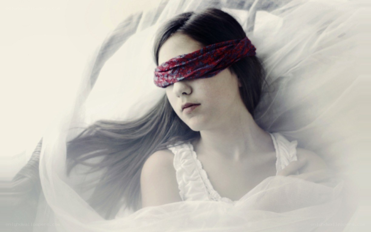 woman with blindfold lying down