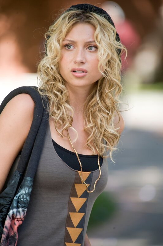 woman with blonde hair and beanie