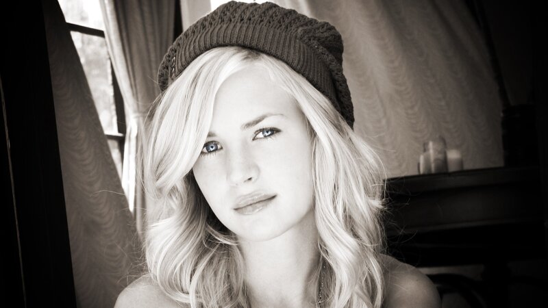 woman with blonde hair and beanie