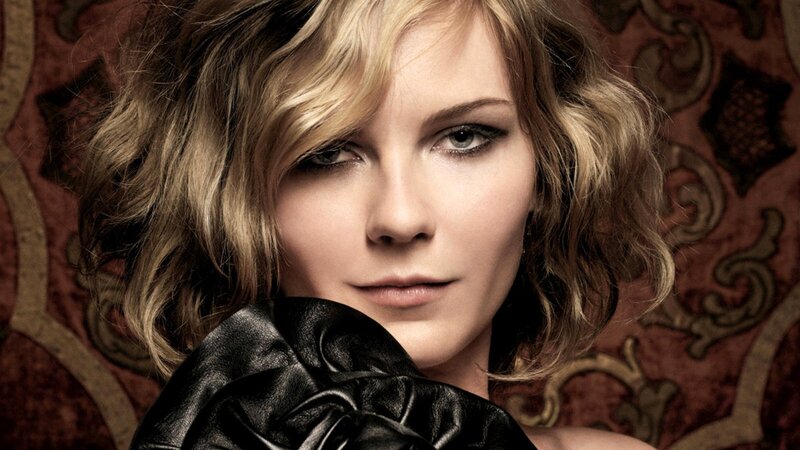 woman with blonde hair and black garment