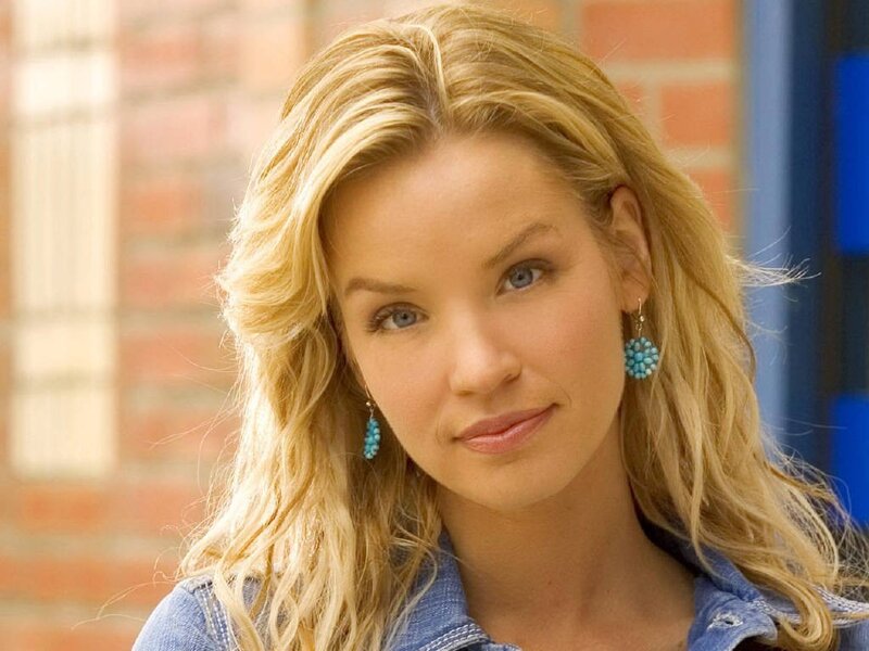 woman with blonde hair and blue earrings